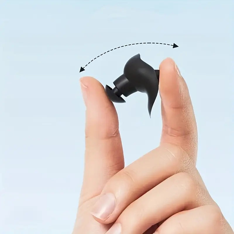 Silikon öronpropp hålls mellan fingrar och roteras enligt pilmarkering för att visa korrekt isättning