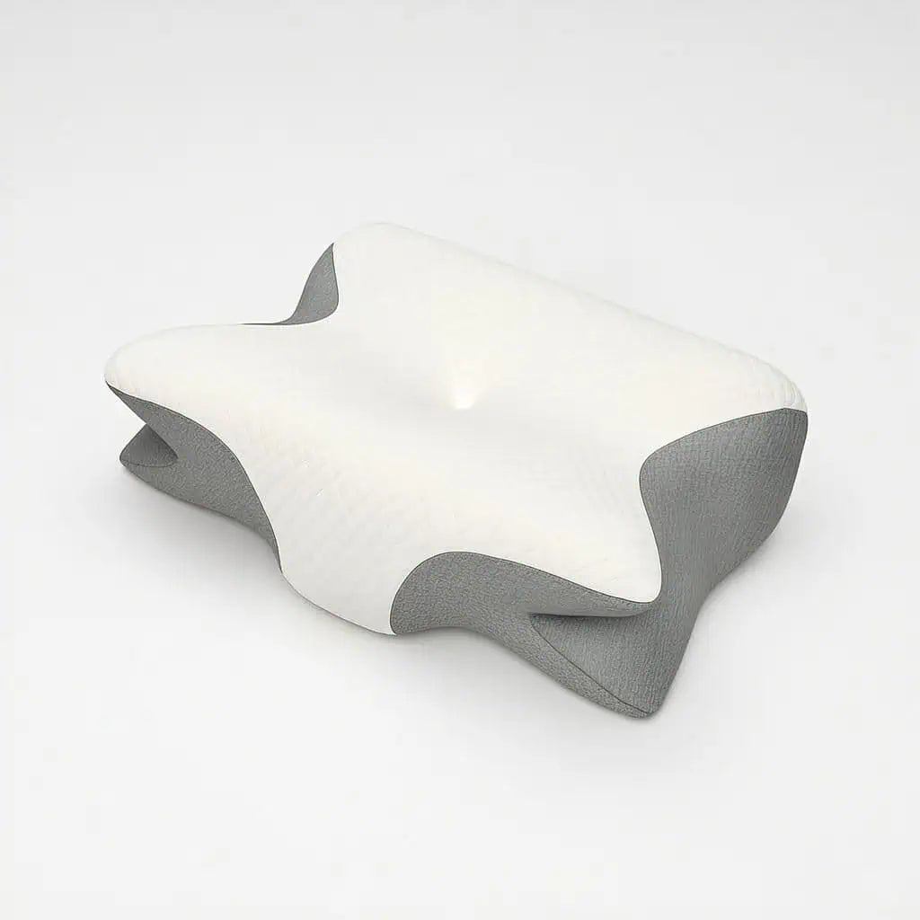 Kudde med ergonomisk form som ger avlastning för nacke och axlar under sömn