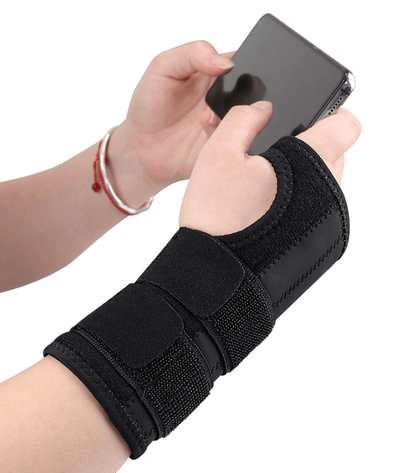 Handledsbandage som ger stabilitet vid användning av mobiltelefon